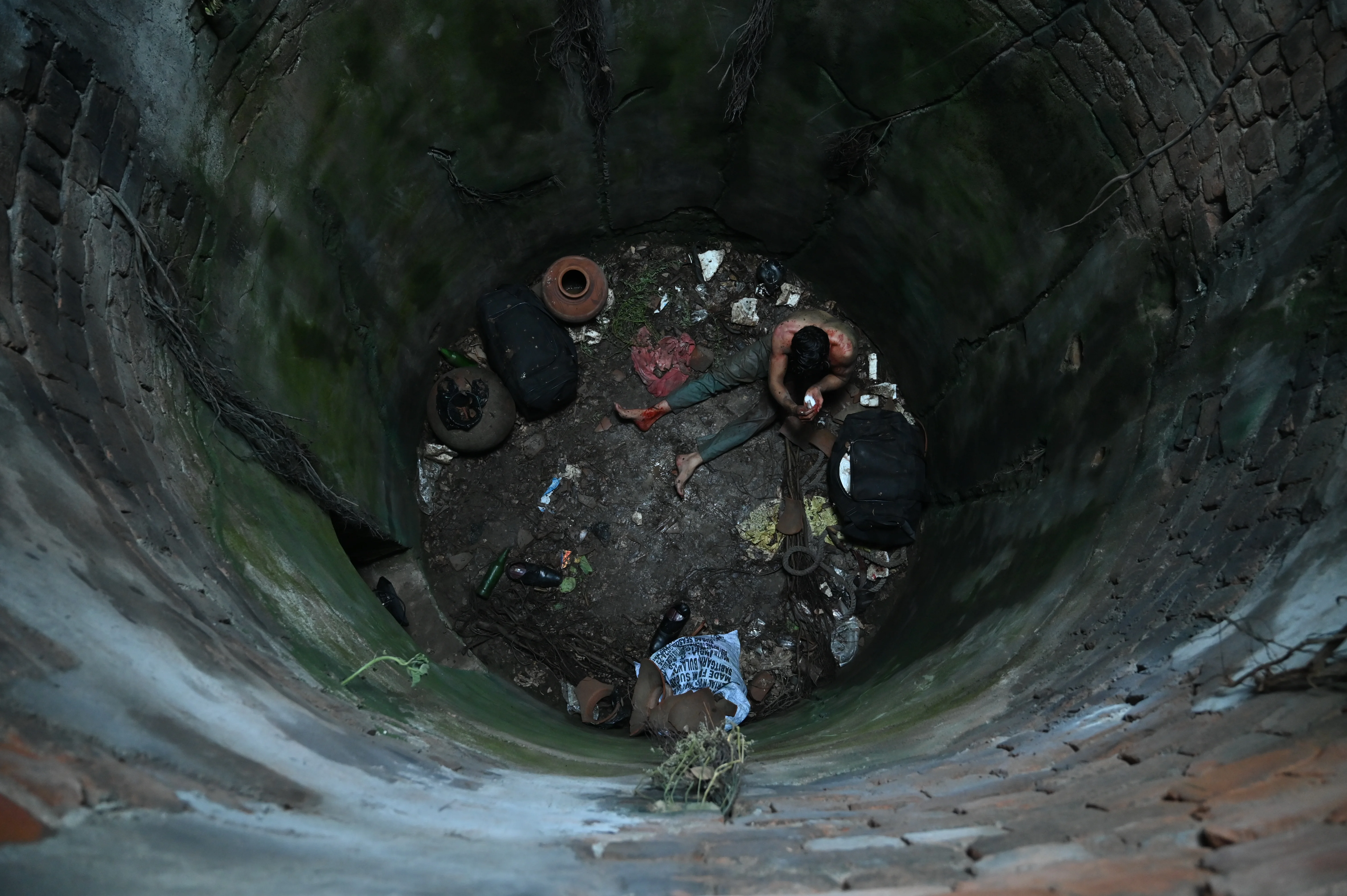 The completed well — actor inside the finished set