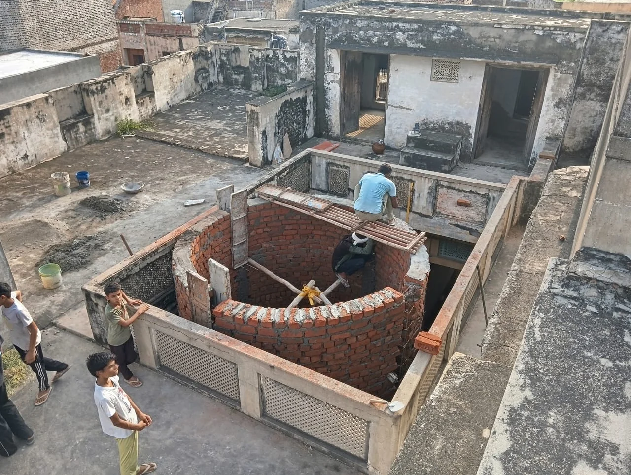 Well under construction in the courtyard